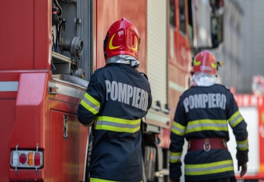 Femeie surprinsă în incendiu