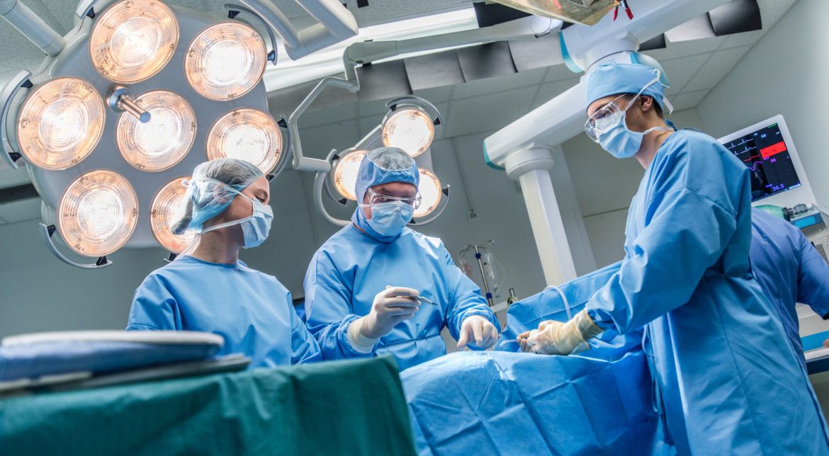 Surgeons in operating theatre